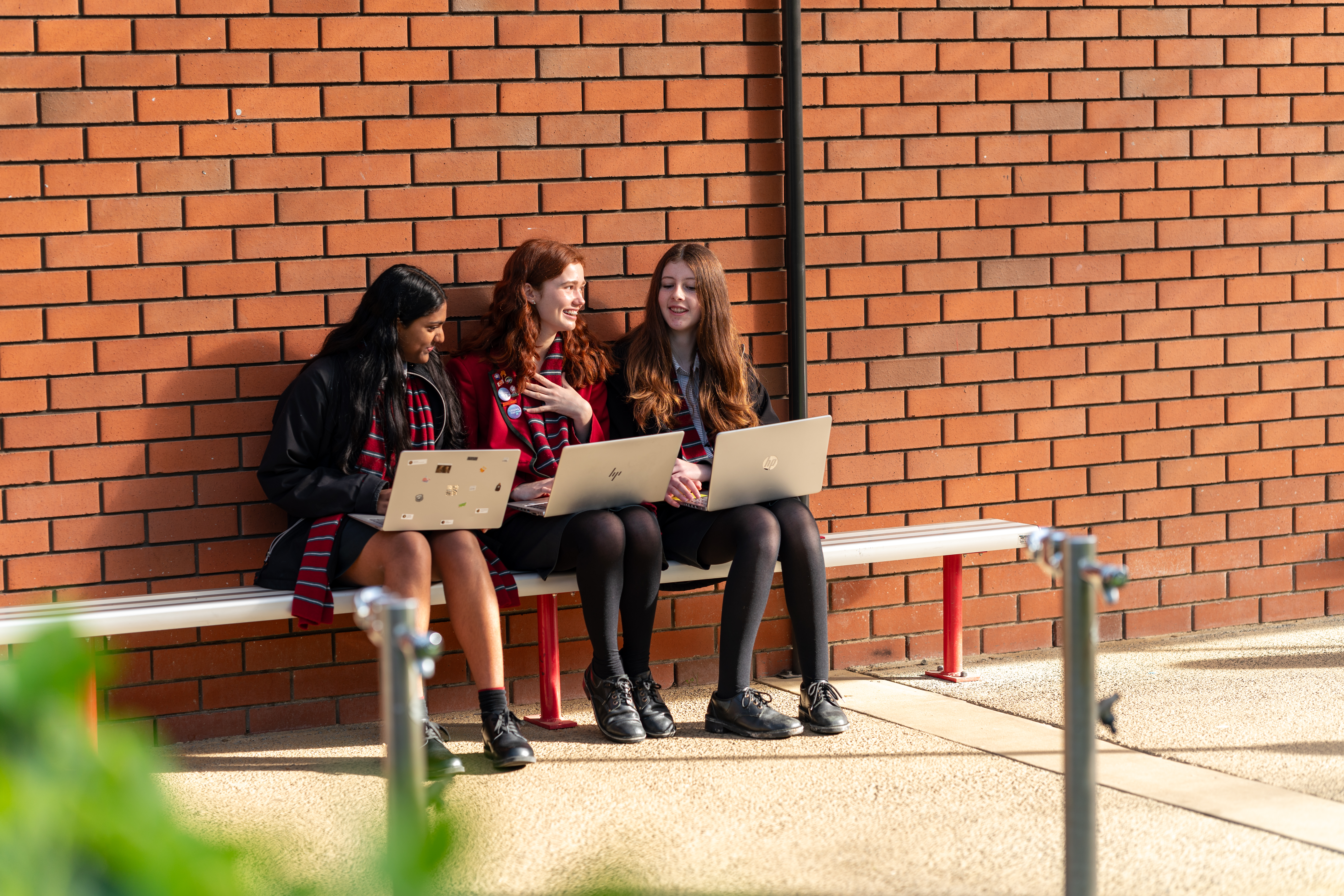 Three girls on their laptops